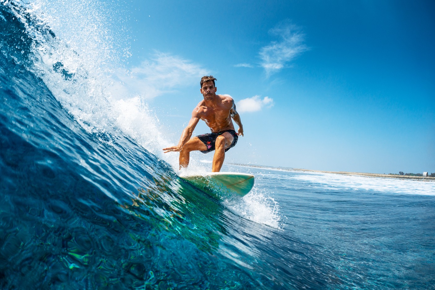 a young man surfing at tangalle